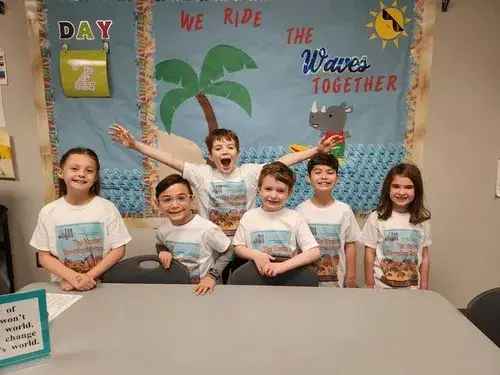 Kids wearing their vacation shirts